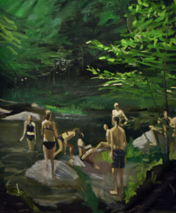 People enjoying lake in forest glade